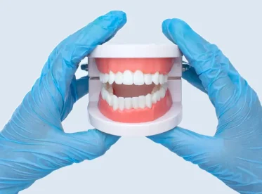 Dental Bridge vs. Dentures: Which Option Is Right for You?